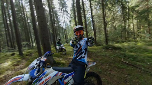 Aerial Footage of Two Motocyclist in the Woods 