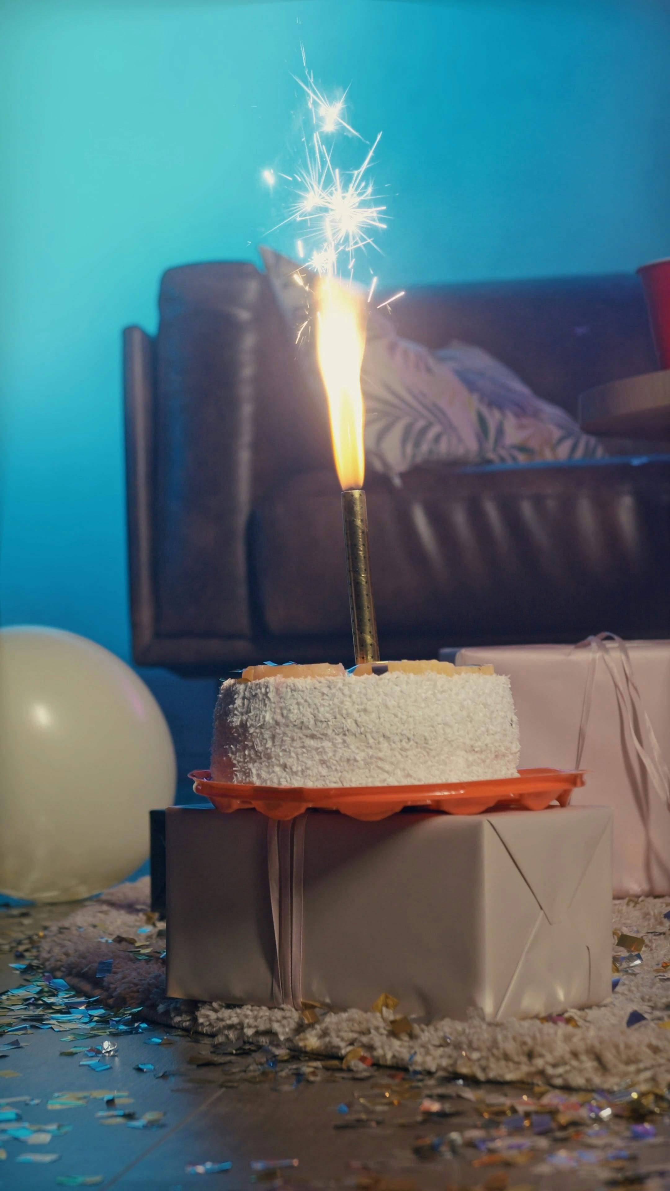 Firework Candle on a Cake · Free Stock Video