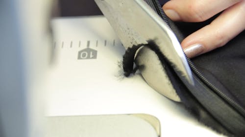 Cutting Fabric with Scissors Close up