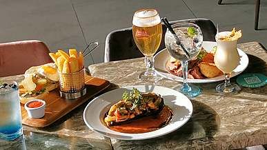snacks and cocktails on a restaurant table