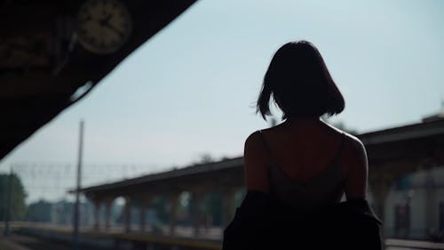 Woman Modeling in a Train Station 