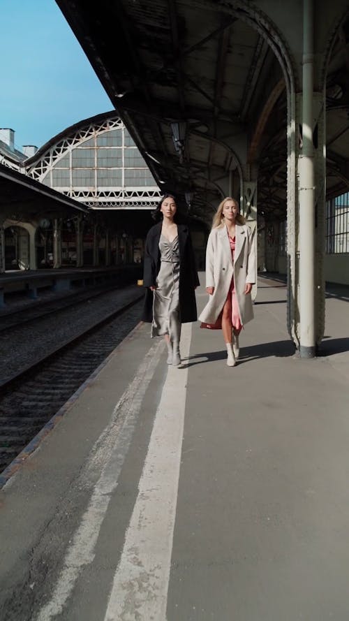 Women Modeling in a Train Station 