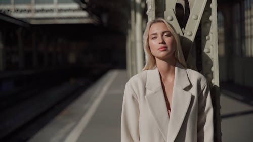 Woman Modeling in a Train Station 