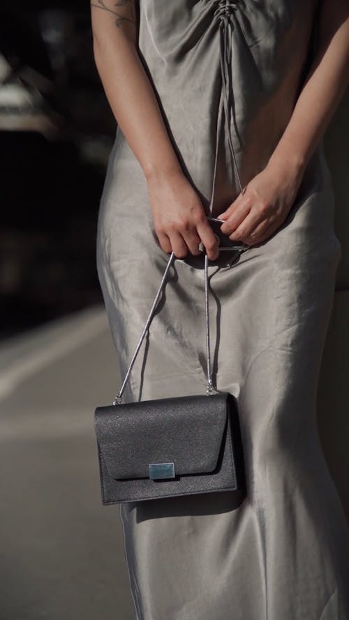 Faceless Woman Modeling with a Grey Dress 