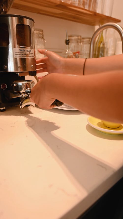 Video of a Person Pressing Ground Coffee