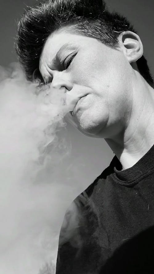 A Person Blowing Smoke