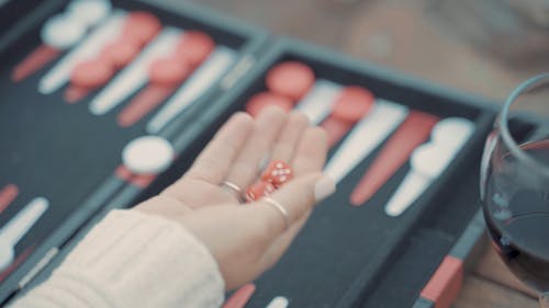 Close-Up Video of a Person Rolling Dice