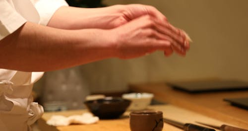 A Person Making a Sushi