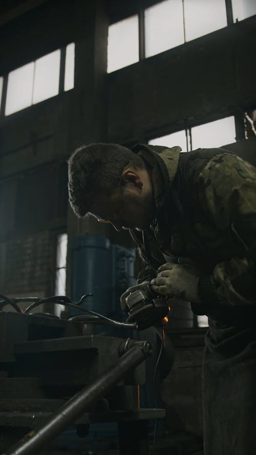 A Man Using an Angle Grinder