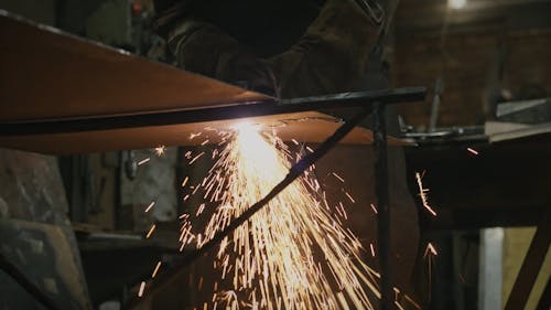 Crop Person Working on Metal With Plasma Cutter