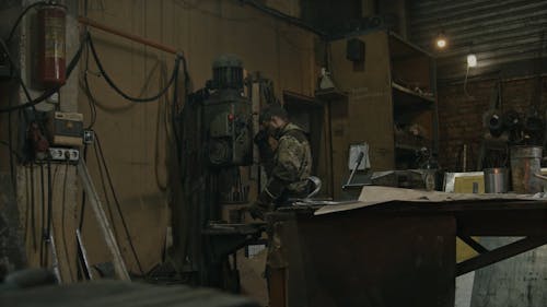 A Blacksmith Working Over a Piece of Metal