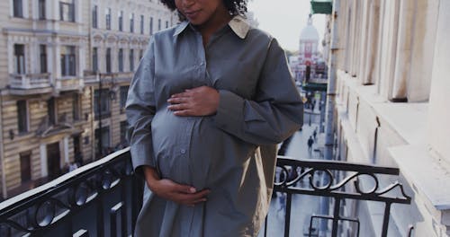A Young Woman Touching her Baby Bump