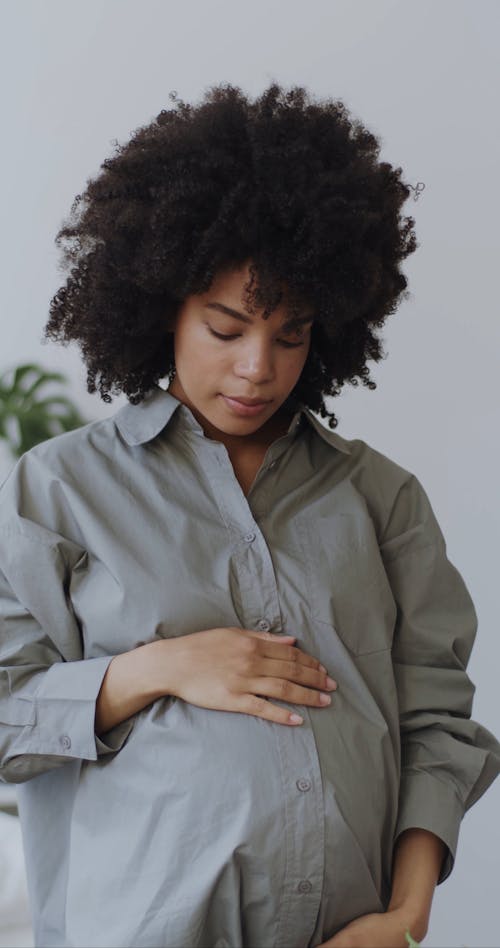 Pregnant Woman Assembling a Flower Arrangement