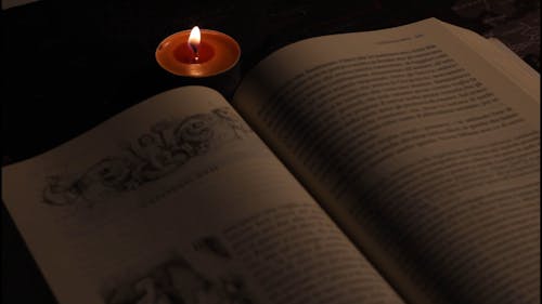 Close Up of a Book and a Tealight 