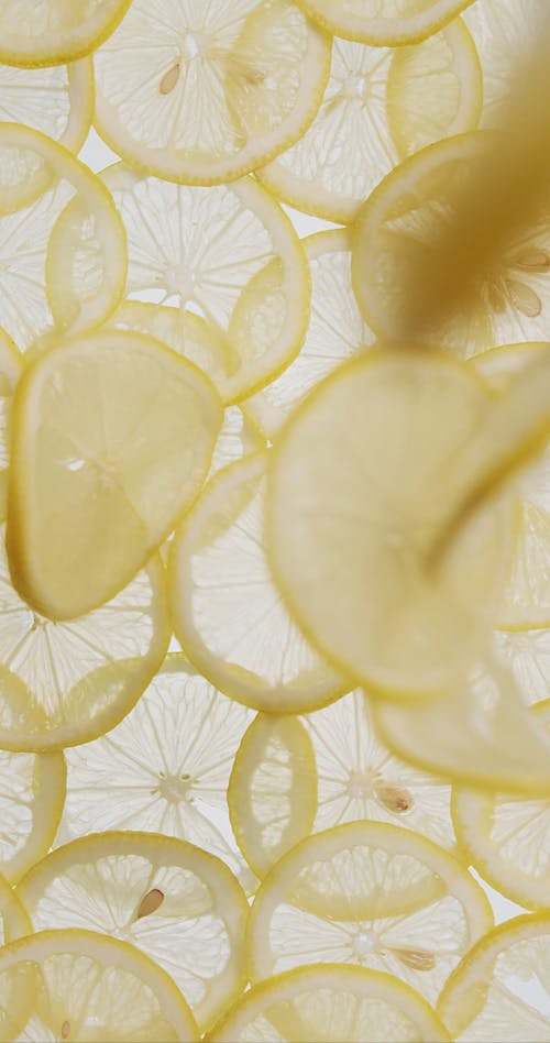Vertical Video of Falling Lemon Slices