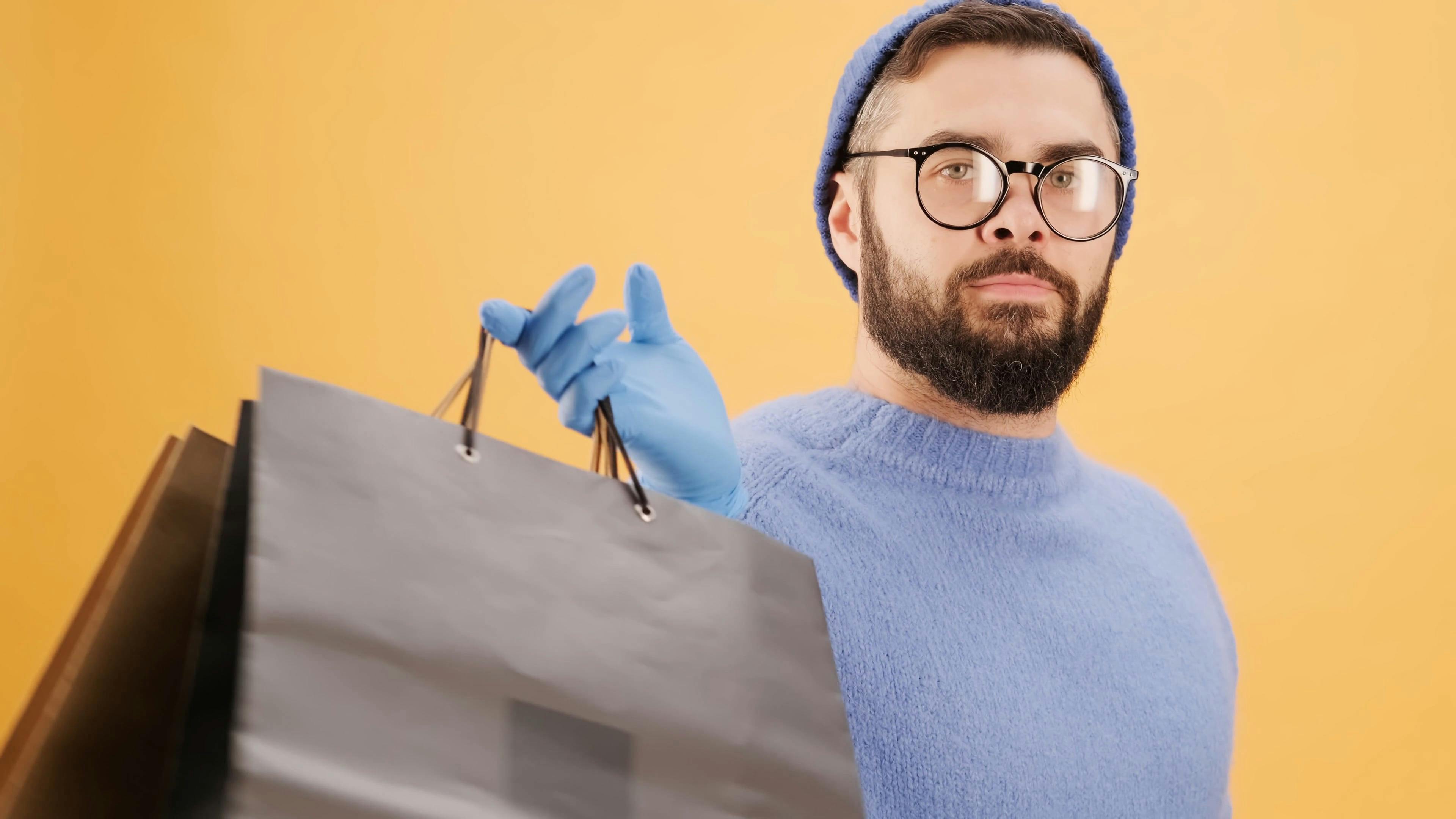 A Man Hand Carrying Shopping Bags Over His Shoulder · Free Stock Video