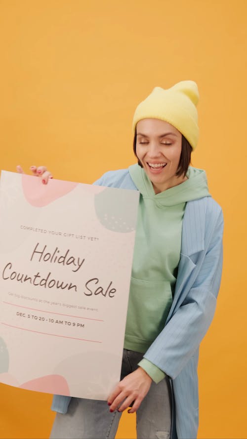 A Woman Holding A Holiday Countdown Sale Poster