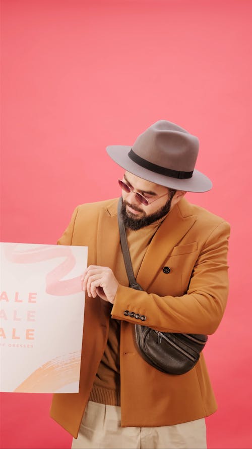 A Man Promoting A Price Sale Offering 