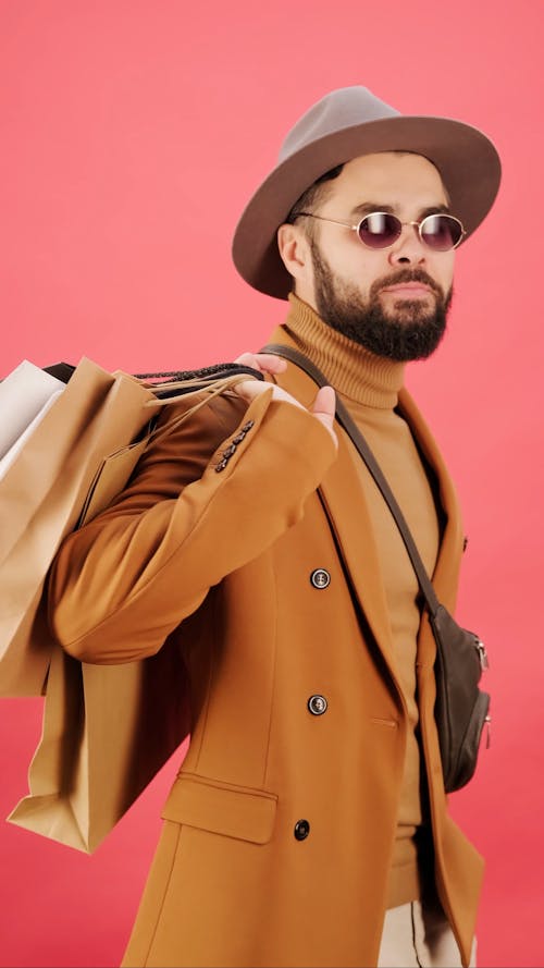 A Fashionable Man Carrying Shopping Bags