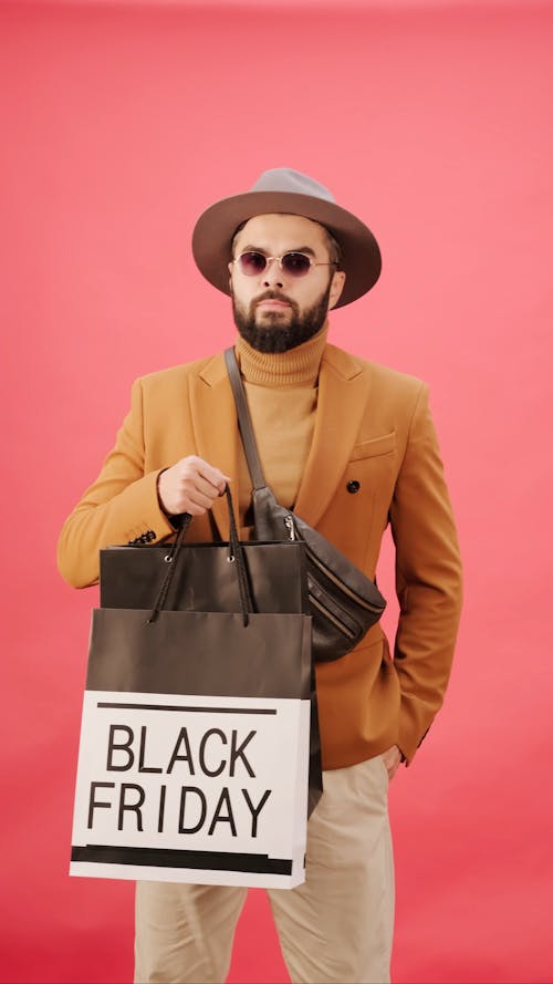 A Man Shopping On Black Friday