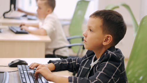 Kids Typing in a Computer 