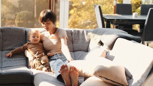 Mother with a Baby in the Couch 