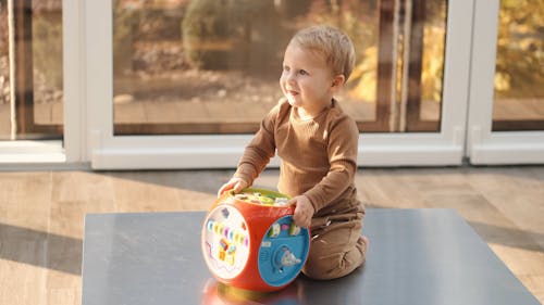 Baby Playin with a Toy at Home