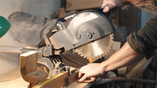 A Person Using Circular Saw