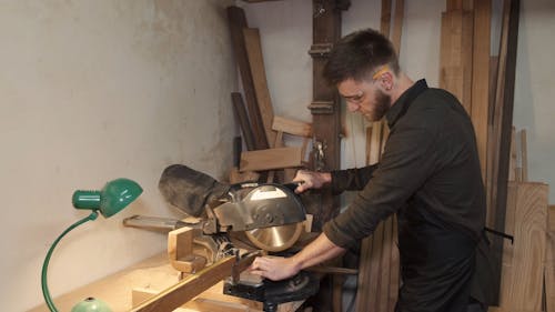 A Man Using Circular Saw