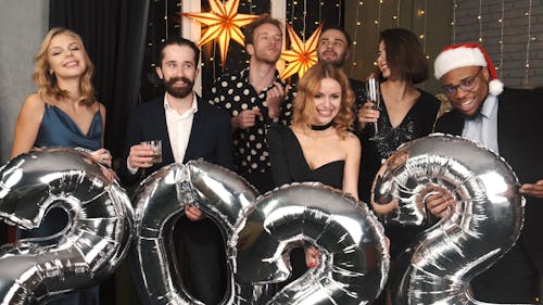 People Holding Huge Balloons at a New Year's Party