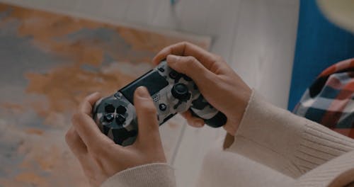 Close up of Hands Using Video Game Controller
