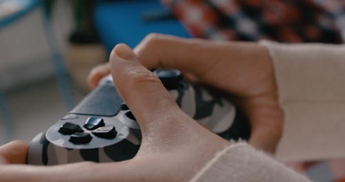 Close up of Hands Using Video Game Controller