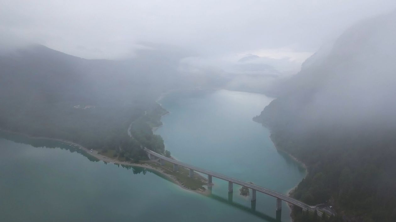 Drone Footage of Mountain Forest and a Bridge Above the Lake Free Stock ...
