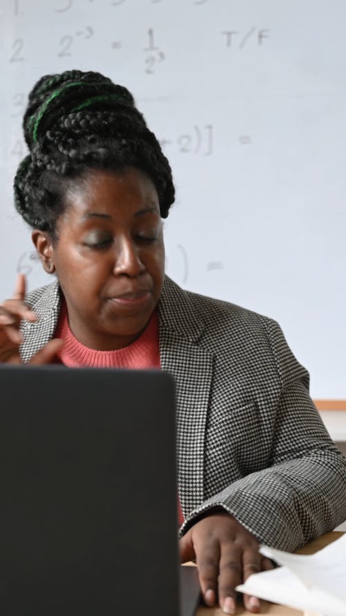 Teacher Giving a Lecture in her Online Class