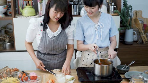 Mom and Daughter Cooking 