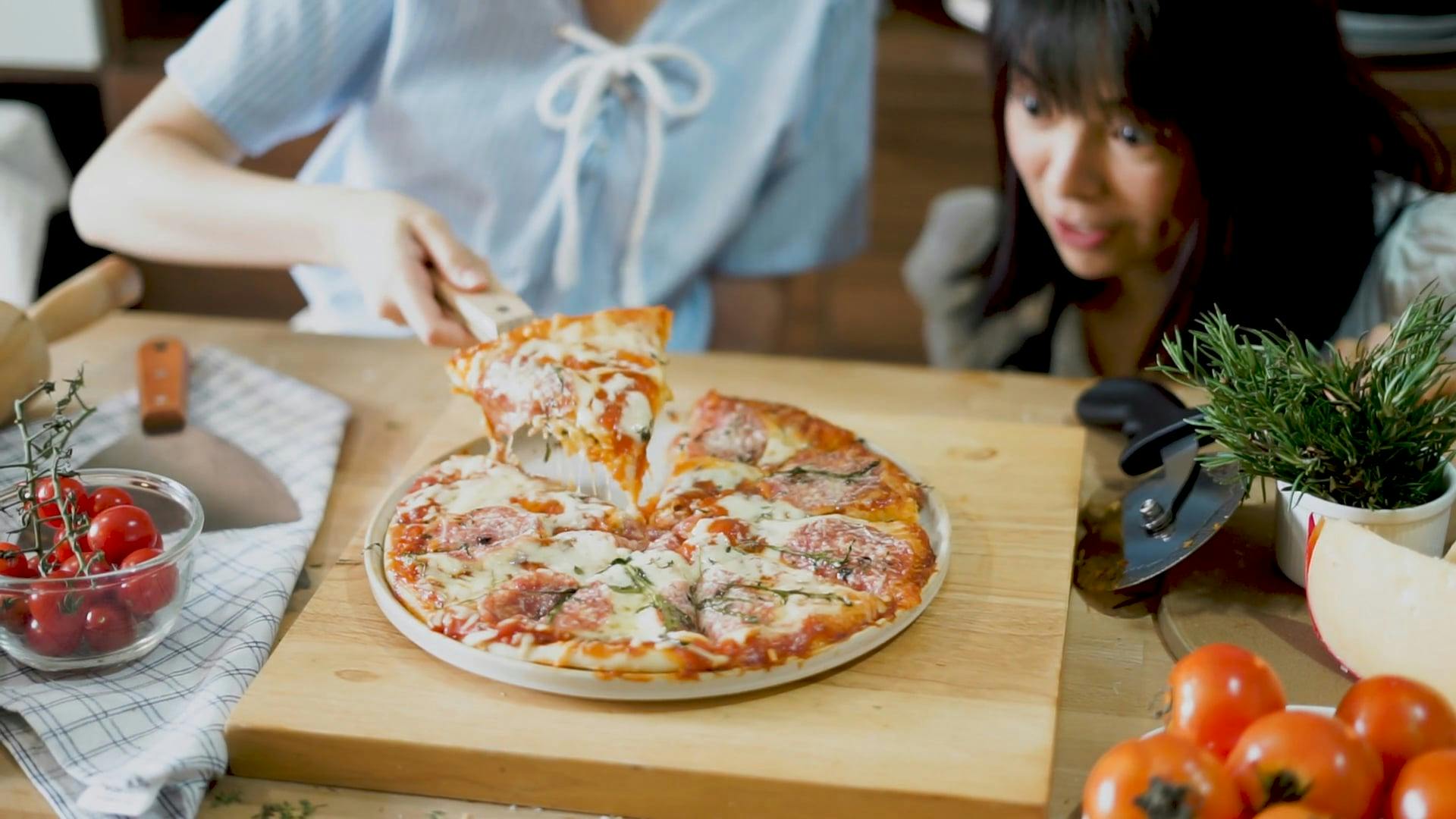 Person Getting a Slice of Pizza · Free Stock Video