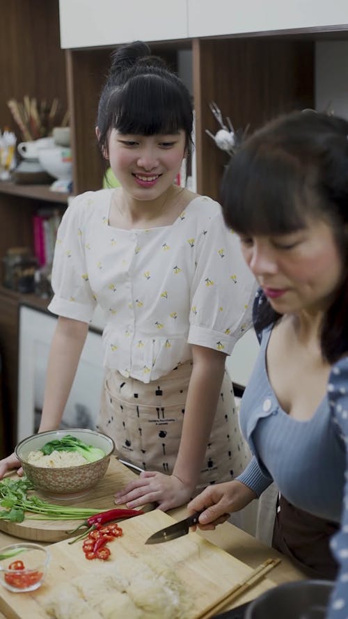 Mom and Daughter Making an Asian Bowl 