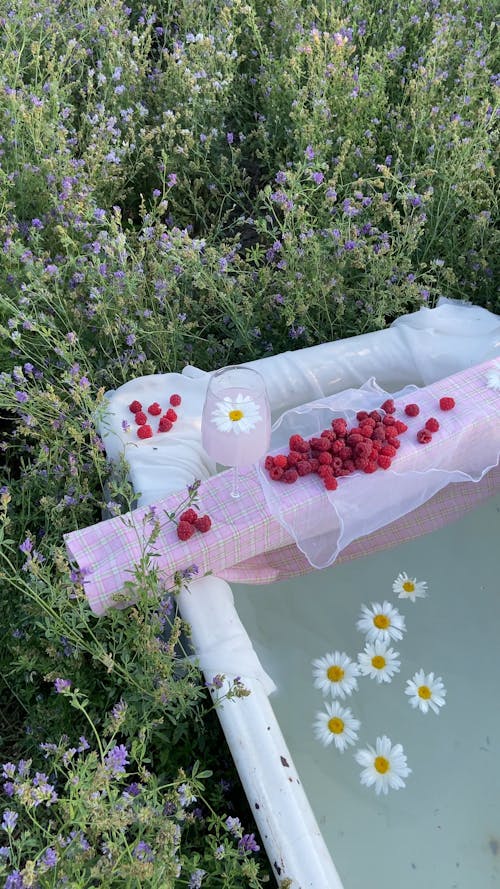 A Bathtub Surrounded with Flowers