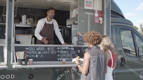 People Talking in Front of a food Truck 
