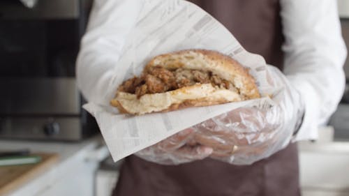 Close-Up Video of a Burger Holding by a Person 