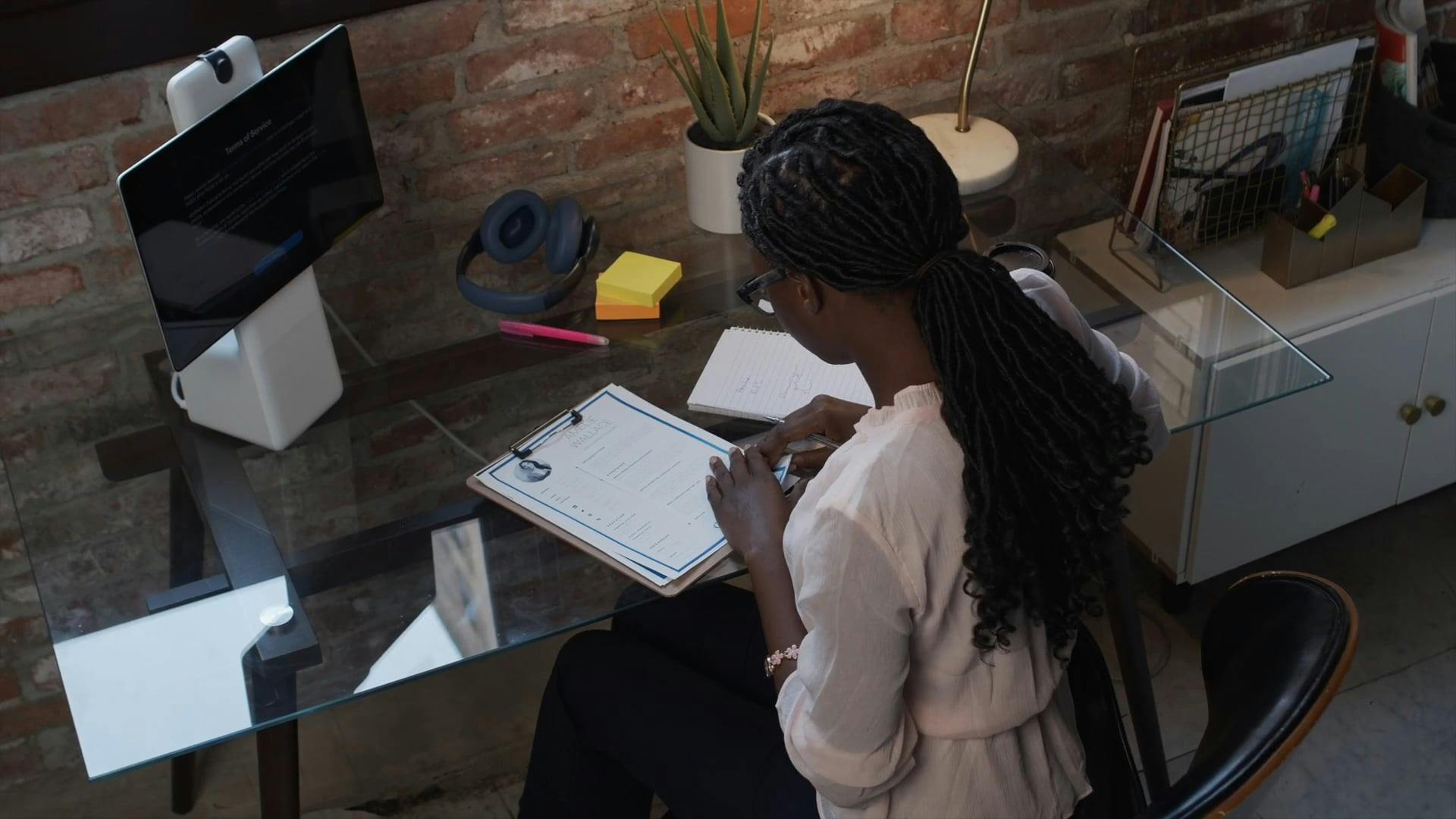 High Angle View of Female Recruiter Looking at Resumes \u00b7 Free Stock Video