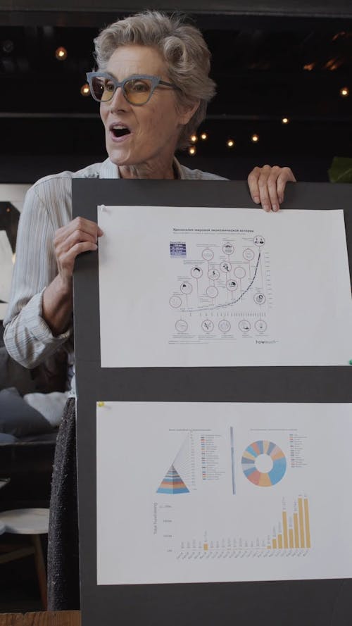 An Elderly Woman Making A Business Presentation