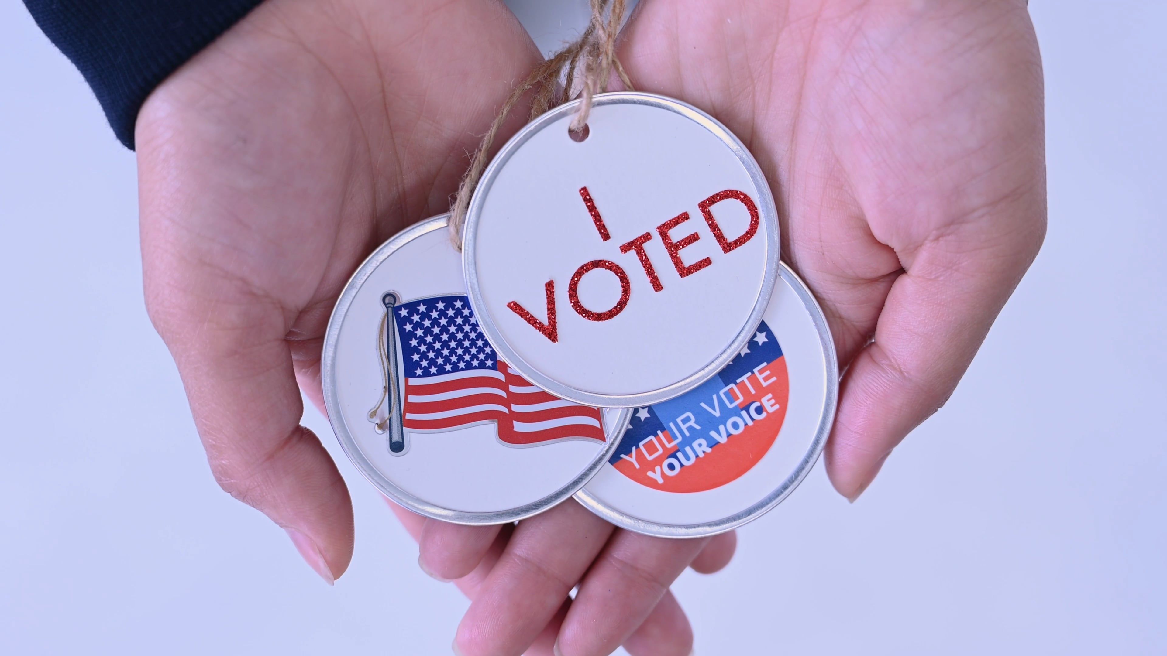 Close Up Shot of Election Buttons Held by Hands Free Stock Video ...