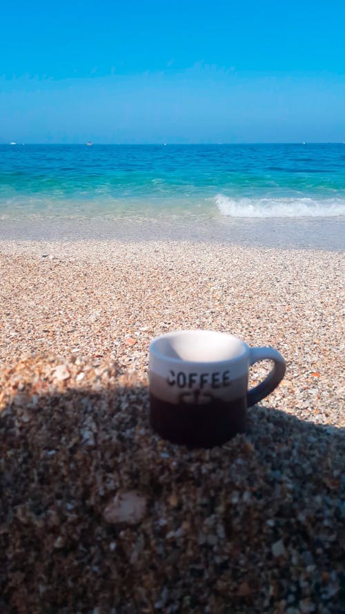 A Cup of Coffee on the Sand