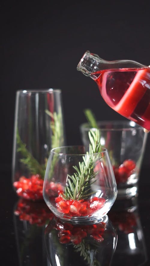 Pomegranate Mocktail Topped with Fresh Rosemary