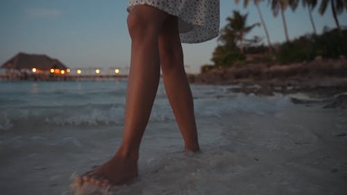 Person Walking in the Beach