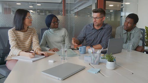 Man Talking To His Colleagues 