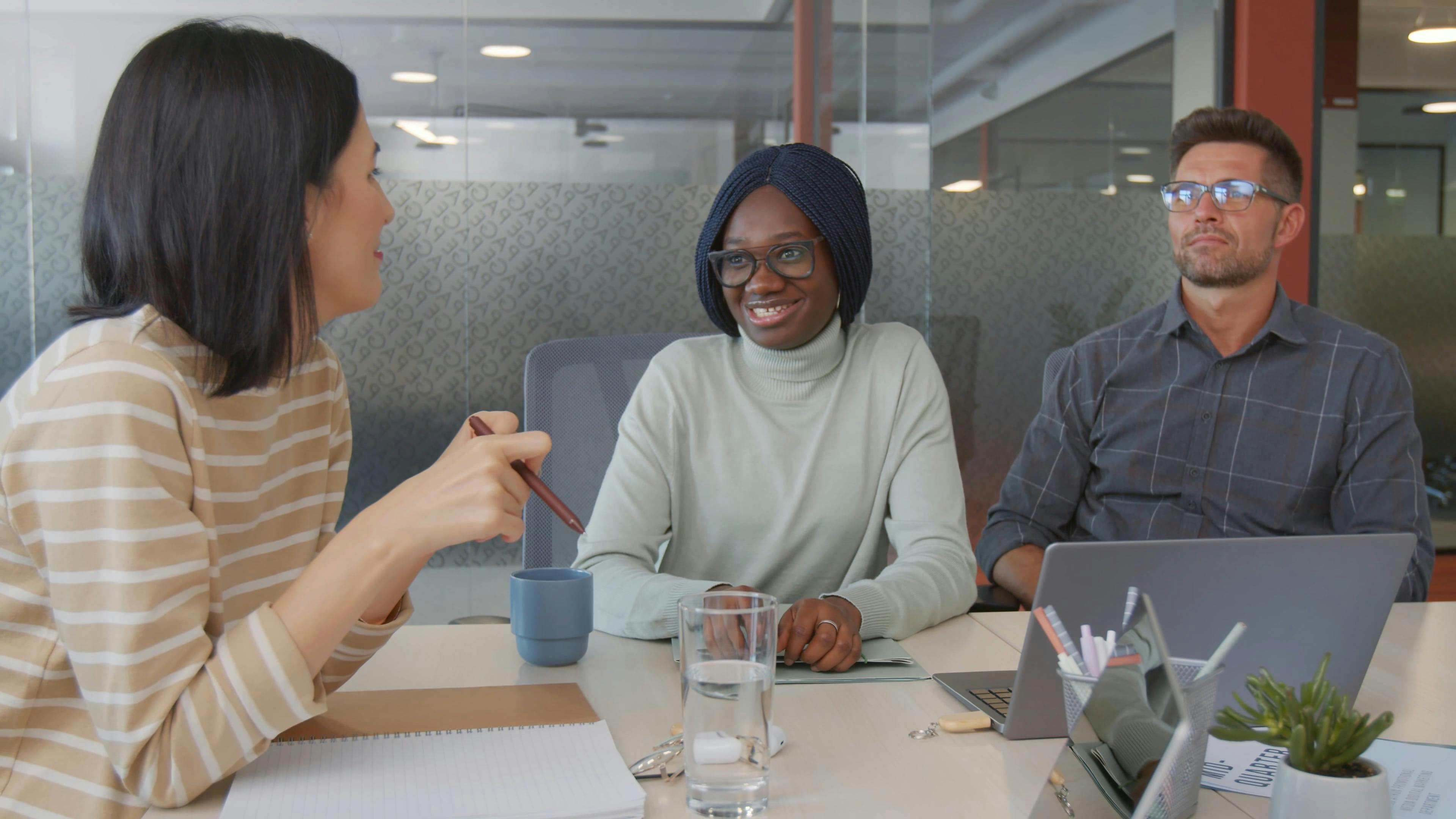 A Young Woman Talking to her Colleagues · Free Stock Video