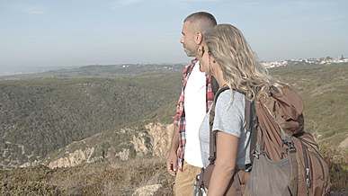 people wearing backpack talking