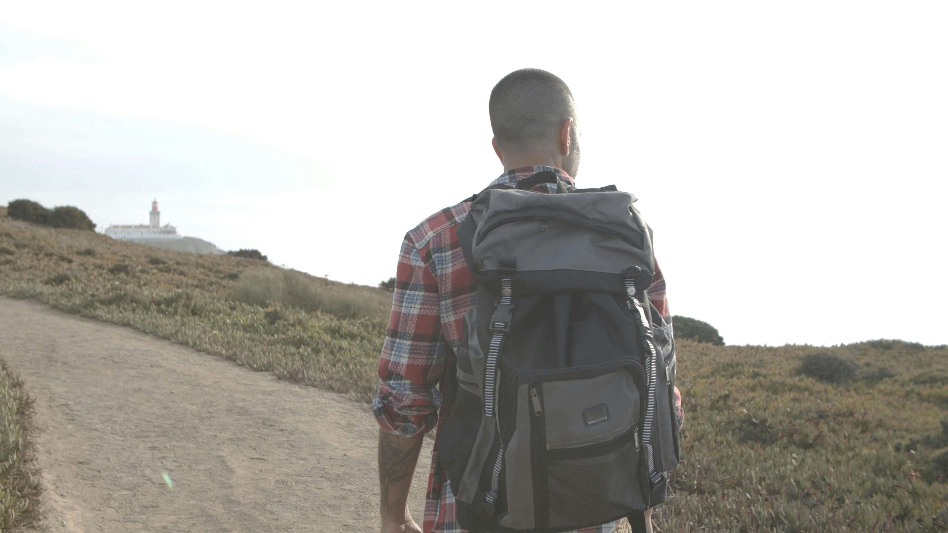Man Wearing Backpack Walking Alone · Free Stock Video
